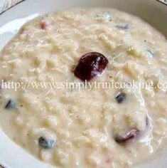 bowl of oatmeal with cranberries and raisins in it