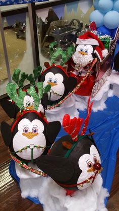 some penguins are dressed up as santa claus and penguin snowmen for the holiday season