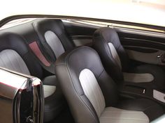 the interior of a car with leather seats