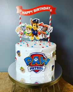 a birthday cake with paw patrol decorations on it