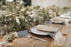 the table is set with place settings and napkins for guests to enjoy their meal