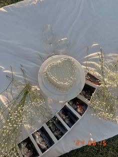 a cake sitting on top of a white table cloth