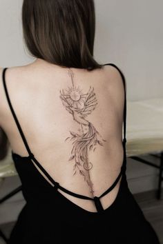 a woman with a tattoo on her back