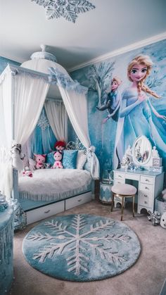 A magical Frozen-themed bedroom with a light blue and white color scheme, a canopy bed, and a whimsical Frozen mural. Want to create a similar room for your princess? Visit our blog for design inspiration! #frozenbedroom #elsabedroom #disneybedroomideas #princessbedroom Frozen Room Ideas, Frozen Room Ideas Bedrooms, Frozen Mural, Disney Princess Bedroom Ideas, Frozen Bedroom Ideas, Frozen Inspired Bedroom, Frozen Theme Room, Frozen Room Decor, Disney Girls Room