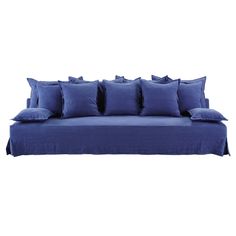 a blue couch with six pillows on it and one pillow is folded over the back