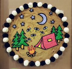 there is a cake decorated to look like camping