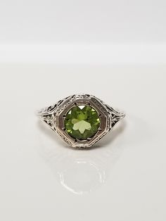 Once in a Blue Moon beautiful vintage finds. Antique Peridot Filigree Ring // Solid 925 Sterling Silver. Antique Remake. Ethical, lab created gemstone. Elegant mid-century style filigree and carving. Size: 6, 8, 9, 10 US * Message me for sizing options Weight: 2.0 g Stone: 1.0 ct (6.5 mm) Band width: 1.2 mm Free shipping, comes packaged in a ring box ready to gift! Valentines For Her, Once In A Blue Moon, Retro Art Deco, Labor Day Sale, Earring Box, Peridot Ring, Filigree Ring, Mid Century Style, Retro Art