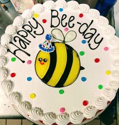 a birthday cake with a happy bee on it