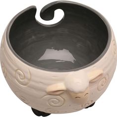 a white ceramic bowl with an elephant design on it