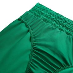 a close up view of the side of a green swimsuit with ruffles