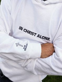 "See store for Christmas deadlines!Introducing the perfect addition to your wardrobe - the Gildan 18500 embroidered with \"In Christ Alone\" across the chest and adorned with a beautifully embroidered cross finished on the arm. This high-quality, comfortable shirt is perfect for both men and women and is made from a durable blend of cotton and polyester. The embroidered design adds a touch of elegance and meaning to the shirt, making it perfect for those who want to express their faith in a styl Embroidery Gifts For Men, Embroidery Easter, Christian Sweaters, Embroidered Cross, Christian Hoodies, Sleeve Embroidery, Embroidery Shirt, In Christ Alone, Shirt Making