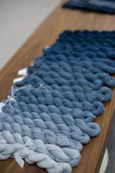 the yarn is blue and white on top of a wooden table with text that reads 72 best natural dyes images on pinterest i natural dying dy