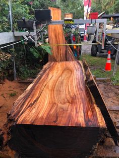 a large piece of wood sitting on top of a field