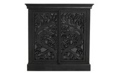 an ornate black cabinet with carvings on the front and side panels, against a white background