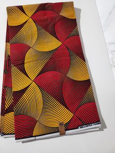 DESCRIPTION Yellow and Red Multicolor African Ankara Fabric. This is high quality African print is 100% cotton and it's 45 inches wide. It is used for making African Clothing, African quilts, & For Home decoration. FYI: Print is Double sided. The listing is for 2yards, 3yards, 6yards and Headwrap Each piece of fabric measures: 70-72in by 45in for 2yards 105-108in by 45in for 3yards 210-216in by 45in for 6yards 70in by 22in for Head wrap If you purchase more than one yard, you will receive one continuous piece. *If you require more than what I have listed, feel free to send me email. CARE INSTRUCTIONS:•DO NOT BLEACH•Hand wash with cold water and mild soap or Dry clean•Press with warm iron on the wrong side only. Color may be different due to your monitor Red Cotton Fabric With Traditional Patterns, Traditional Red Cotton Fabric, Traditional Red Cotton Fabric And Notions, Colorful Patterned Red Ankara Fabric, Red Cotton Fabric With Colorful Pattern, Red Batik Print Cotton Fabric, Red Cotton Fabric With Batik Print, Red Printed Cotton Fabric, African Quilts