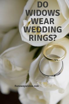 two wedding rings sitting on top of white flowers with the words do widowes wear wedding rings?