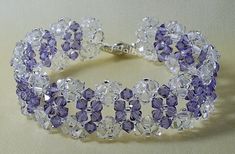 a bracelet with purple and clear crystal beads