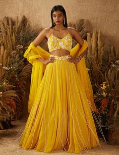 Shloka Khialani-Yellow Jaune Embellished Lehenga Set-INDIASPOPUP.COM Purple Lehenga, Haldi Outfit, Yellow Lehenga, Embellished Blouse, Draped Skirt, Embroidered Neckline, Layered Skirt, Dry Clean Only, Embroidered Blouse