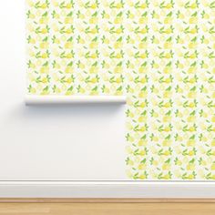 an empty room with yellow and green wallpaper