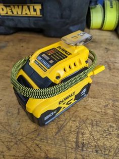 a corded tool sits on top of a work bench