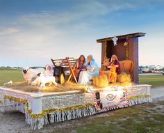 a float with people and animals on it