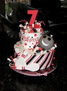 a cake that is decorated with bowling pins