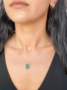 This elegant, timeless necklace features a stunning 3.76ct rich green Zambian emerald that is the focal point of the design. The emerald is set into a classic prong design that can be worn vertically or horizontally on the chain to suit any occasion. With this necklace, you can easily transition from a day in the office to a night on the town. ♥ The pendant measures 7mm in width, 13mm in length, and is 5.5mm thick. ♥ The necklace chain shown is included and measures 17.5" with a slider bead that Fine Jewelry With Rectangular Pendant For Formal Occasions, Classic Green Necklace With Rectangular Pendant, Elegant Green Emerald Necklace With Rectangular Pendant, Timeless Emerald Necklace Gift, Minimalist Emerald Jewelry For Formal Occasions, Green Emerald Baguette Cut Necklace, Formal Fine Jewelry Emerald Necklace With Baguette Cut, Minimalist Emerald Cut Green Jewelry, Formal Fine Jewelry Baguette Cut Emerald Necklace