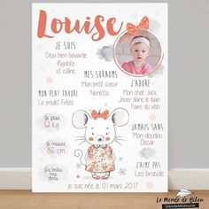 a baby's birth announcement with a mouse on the front and an orange bow