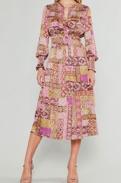 Elevate your wardrobe with our Tile Printed Midi Dress. This elegant dress features long sleeves, a split neck, and a flattering elastic tie waist. The midi length and smocking top and cuff details add a touch of sophistication. Perfect for any occasion, this dress exudes luxury and exclusivity. Material: 50% Recycled Polyester / 50% Polyester Toddler Boots, Long Sleeve Kids, Tile Print, Boys Bottoms, Cuff Detail, Boys Pajamas, Printed Midi Dress, Mens Fragrance, Kids Tops