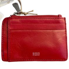 New With Tags Hobo International Credit Card Id Wallet Red Hobo Premium Leather Msrp $58.00 Slim Design Front Features: Four Credit Card Slots, One Slip Pocket, One Zip Pocket With Signature Wanderlust Textile Lining. Back Features: Two Credit Card Slots, One Slip Pocket, One Clear Id Window With Thumb Glide. Silver Hardware Measures 4.75"L X 3.5"H Smoke-Free Home Prompt Shipping From Sunny California Red Coin Purse With Coin Pocket For Daily Use, Everyday Red Bifold Coin Purse, Red Bifold Coin Purse For Everyday, Red Rfid Blocking Coin Purse For Daily Use, Red Rfid Blocking Wallets For Everyday Use, Red Rfid Blocking Wallets, Red Rfid Blocking Wallet, Casual Red Travel Wallet, Hobo Wallet