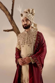 Editor's Note Featuring our work of art in our sand grey sherwani which is intricately hand-embroidered with resham, silver threads, dabka and zari. Paired with a wine hand-embroidered stole and a matching safa. Fabric: Linen silk Color: Sand grey Components: Sherwani, kurta, churidar, stole and safa Occasion: Groom Fit: Regular Note: Product colour may slightly vary due to photographic lighting sources Care: Dry clean only About the Designer After establishing himself as the leading couturier i Grey Sherwani, Manpreet Toor, Jatin Malik, Blouse Yoke, Dhoti Pants, Haldi Ceremony, Royal Look, Indian Man, Color Sand