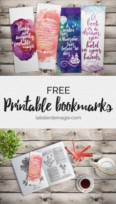 the free printable bookmarks are on display in front of a wooden table with flowers and