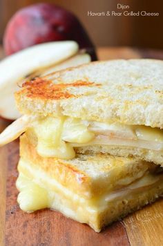 a grilled cheese sandwich with apples on the side