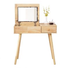 a wooden desk with a mirror and vase on it's top, against a white background