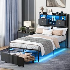 a bedroom with a bed, night stand and blue light under the bed is shown