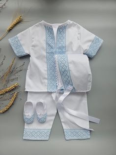 Nice christening white baby boy suit with the blue cotton lace.  Made from soft pure polished cotton and cotton lace. It looks very nice and glitters elegantly.  The photo of the boy in the same suit but with other kind of lace i is to demonstrate how the suit could fit.  This outfit, suit, hat,  and booties have blue lace.  The outfit includes a shirt and pants.  Booties, hats are available to add in the Set option.  The personalization embroidery could be on booties, and shirt.  - 100% Fine Cotton Fabric - 100% Cotton Blue Lace - White Color - Set of SKU is Optional (please choose one at the SET option on this page) Size Chart for child's height: Suit Preemie           50 - 56 cm    19.68 - 22.04 inches  Newborn          56 - 62 cm     22.04 - 24.40 inches 0-3 months      62 - 68 cm White Cotton Sets For Baptism, White Cotton Baptism Sets, Cotton Baptism Sets, Elegant Blue Sets For Baptism, Baptism Boy Outfit, Meme Costume, Baby Boy Shirts, Suit White