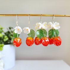 Our Strawberry 3D flower earrings are crafted with hand paint resin strawberry, flower and leaf. The hooks are 925 sterling silver which are good for delicate ears.Size: Single strawberry is 0.8" wide and 2" long Multi strawberry is 1" wide and 2" long Resin Fruit, Earrings Cottagecore, Cottagecore Food, Cottagecore Earrings, Kawaii Fruit, Rain Design, Strawberry Flower, Peach Earrings, Food Earrings