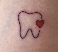 a small tooth with a heart tattoo on the side