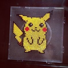 a pikachu made out of perler beads