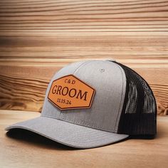 Check out the bulk pricing discount codes for orders of 6 or more hats! Custom Groom leather patch trucker hat. All patches are engraved on 100% veg-tanned leather. Once engraved, your custom leather patch is cut, dyed and sealed before pressing it onto your hat. These hats are great for your groom, groomsmen and best man. Best Man Cap, Groom Hat, Groomsmen Hats, Bridal Party Hats, Personalized Caps for Wedding Party, Personalized Hat for Groom, Baseball Hat for Groomsman, Black Wedding Hats, Tr Groomsmen Hats, Groom Hat, Bridal Party Hats, Personalized Hats, Groomsmen Gifts, Wedding Hats, Ring Bearer, Custom Hats, Custom Leather