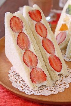 two slices of cake with strawberries on them