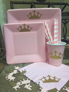 pink and gold princess themed party supplies including plates, cups, napkins and paper straws