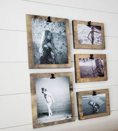 four wooden frames hanging on the wall displaying photos