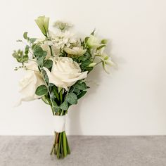 Delicate bridesmaid bouquet in all white color palette featuring roses featured in San Francisco wedding Bridesmaid Bouquet Eucalyptus White, Simple Rustic Bridesmaid Bouquet, Small Wedding Boquetes Of Flowers, Olive Bouquet, White Bridesmaid Bouquet, Small Simple Wedding, Maid Of Honor Bouquet, Diy Bridesmaid Bouquet, Internally Screaming