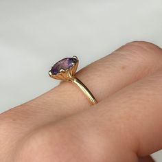 Combining timeless elegance with a touch of sea-inspired charm, our Scallop Cup Solitaire is a one-of-a-kind ring! It features a weighty, 14k recycled yellow gold band with a classic, rounded shank and polished finish. This specific Scallop Cup Solitaire features a beautiful, pastel purple oval sapphire from Sri Lanka. Center Stone Details: Gemstone: Sapphire Hardness: 9/10, great for everyday wear! Carat Weight: 1.97ct Shape + Cut: Modern Oval Brilliant/Roval Origin: Sri Lanka Dimensions: 8.47x Timeless Yellow Gold Amethyst Ring With Oval Shape, Timeless Oval Amethyst Ring As Gift, Timeless Oval Amethyst Ring For Gift, Classic Oval Lavender Jewelry, Classic Lavender Oval Jewelry, Solitaire Amethyst Ring In Yellow Gold, Oval Shape, Yellow Gold Tanzanite Solitaire Jewelry, Oval Solitaire Amethyst Ring In Yellow Gold, Oval Amethyst Ring In 14k Yellow Gold