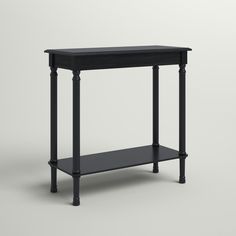 a black console table with two shelves on one side and an open shelf on the other