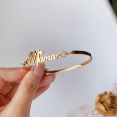 This bangle is handmade according to your names and size,High-quality gold plating, lasting color retention,3 mm width is very dainty,If you order this for baby,we could make it according to the size the baby need,just note the size please. Material： stainless steel, high-quality 18 K gold Plated(High quality Color retention) Size: Bangle width: 3 mm, Name plate size: about 8 mm*35 mm(Adjust according to name length) Custom: 1, Select the color and size you need. 2, Input the name and font you w Gold Bracelets With Names For Anniversary, Gold Name Bracelet As Gift For Mom, Personalized Yellow Gold Name Bracelet For Mother's Day, Personalized Yellow Gold Name Bracelet For Wedding, Customizable Nameplate Bracelet For Mother's Day, Gold Custom Name Bracelet For Anniversary, Engraved Name Bangle Bracelet For Mother's Day, Rose Gold Name Bracelet For Mother's Day, Customizable Name Bracelet For Birthday And Mother's Day