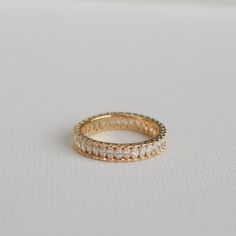 The sister of our Baguette Eternity Ring, this gem showcases marquise crystals around the entire band, bordered with a scalloped edge for comfort. Perfect layering ring for that trending chunky bold look. MATERIALS: Gold Plated, Brass Cubic Zirconia Need some jewelry inspiration? Follow us on Instagram @statementGrey Marquise Eternity Band With Diamond-cut Cubic Zirconia, Marquise Cut Cubic Zirconia Eternity Band Gift, Marquise Cut Diamond Eternity Band Gift, Diamond Eternity Band With Marquise Cut, Marquise Half Eternity Ring For Gift, Oval Cubic Zirconia Eternity Band As Gift, Baguette Eternity Ring, Gold Eternity Band, Eternity Ring Gold