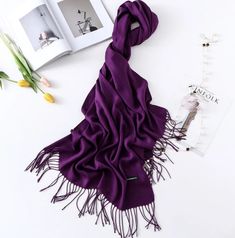 This tasseled oversized cashmere-blend scarf is the perfect piece to keep you warm and stylish this winter while on the go. Can be used as a scarf or a shawl. Branded with company logo. Dimension: 78 x 28 inches Cashmere/Polyester blend Tassels at Hem Care: Dry Clean Brand Logo Elegant Fringe Shawl Scarf, Solid Color Fringe Scarf For Fall, Elegant Fringed Shawl Scarf, Elegant Fall Shawl Scarf, Elegant Shawl Scarves For Fall, Elegant Fringed Scarves For Fall, Elegant Fall Shawl With Tassels, Elegant Solid Color Winter Scarves, Elegant Winter Shawl Scarves