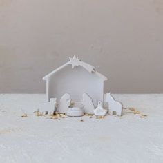 a white nativity scene with the birth of jesus